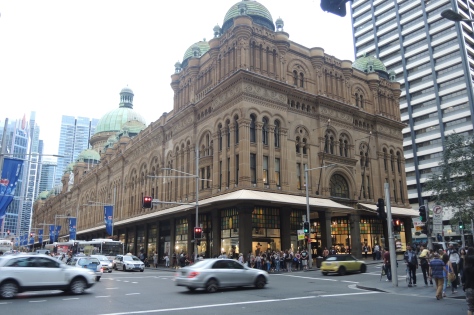 Old looks can be captivating in a bold new city. Here the Queen Victoria Building maintains classic outside architecture in the shade of tall new skyscrapers.